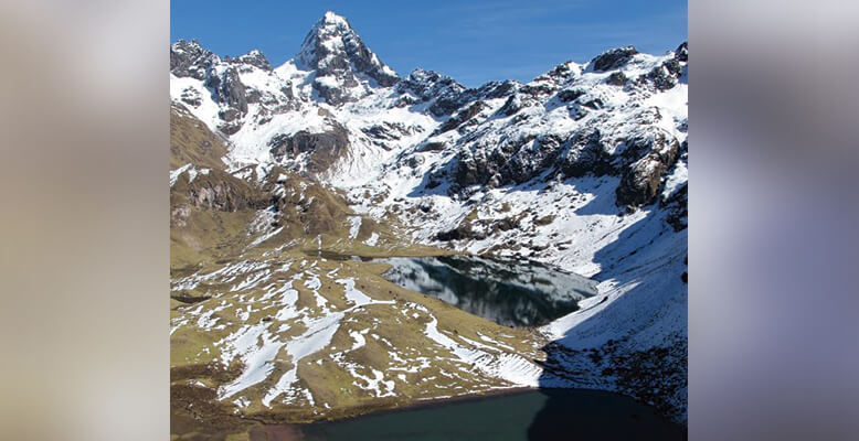 A mountain range with snow on the top of it.