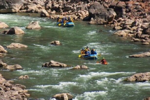 A group of people in rafts on the river.