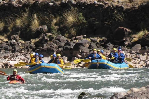 Whitewater rafting team navigating rapids.