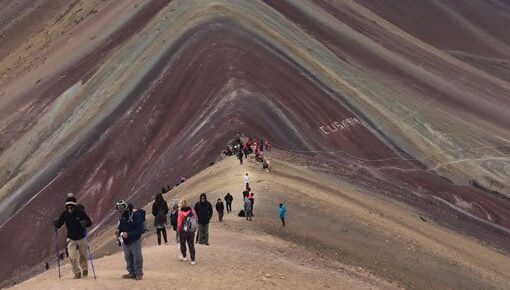 Rainbow Mountain hikers on scenic trail.